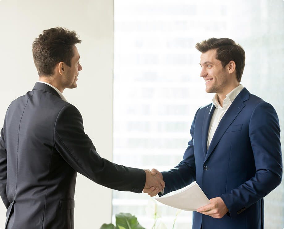 Two business men shaking hands